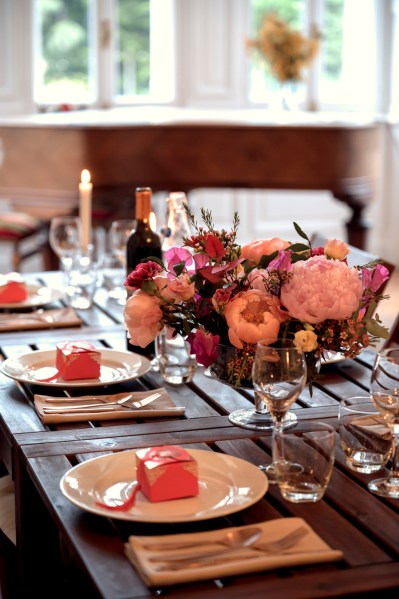 Up close detail of roses pink flowers cutlery on table